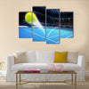 Flying tennis ball on a blue court Multi panel canvas wall art