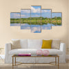 Calm beautiful rural landscape with a lake, Sweden multi panel canvas wall art