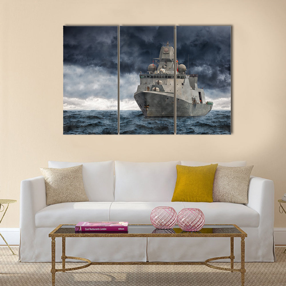 The military ship on sea against heavy clouds Multi Panel Canvas Wall Art