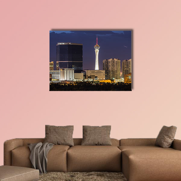 Stormy night sky behind the Stratosphere and Fontainebleau towers on the Las Vegas Strip Multi panel canvas wall art