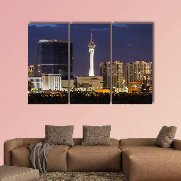 Stormy night sky behind the Stratosphere and Fontainebleau towers wall art