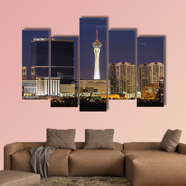 Stormy night sky behind the Stratosphere and Fontainebleau towers on the Las Vegas Strip Multi panel canvas wall art