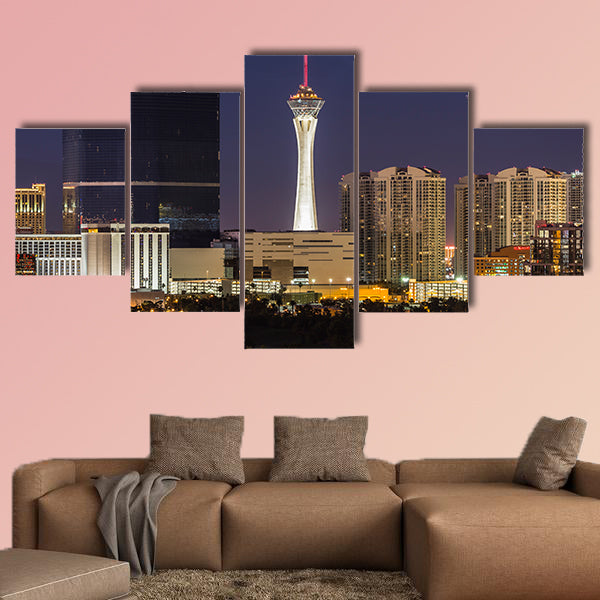 Stormy night sky behind the Stratosphere and Fontainebleau towers on the Las Vegas Strip Multi panel canvas wall art