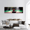 Young woman in yoga pose sitting near waterfall Panoramic Canvas Wall Art