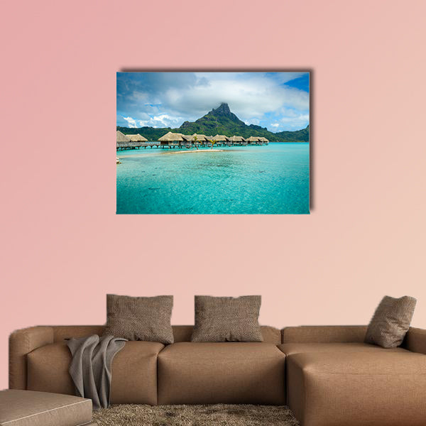 Luxury thatched roof over water bungalow resort in a vacation wall art