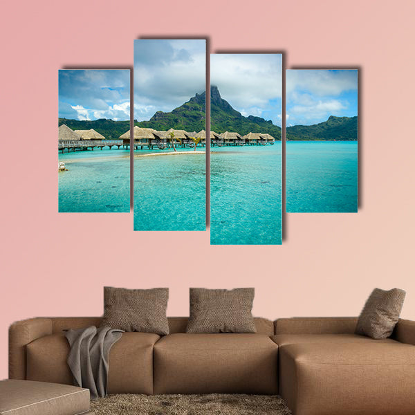 Luxury thatched roof over water bungalow resort in a vacation wall art