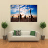 Beach volleyball silhouette at sunset Multi panel canvas wall art