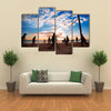 Beach volleyball silhouette at sunset Multi panel canvas wall art