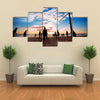 Beach volleyball silhouette at sunset Multi panel canvas wall art