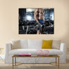 Muscular bodybuilder guy doing exercises with big dumbbell in gym, Multi panel canvas wall art