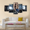 Muscular bodybuilder guy doing exercises with big dumbbell in gym, Multi panel canvas wall art