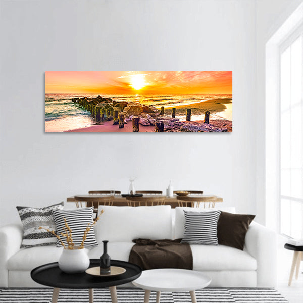 Colourful sunset on a beach panoramic canvas wall art