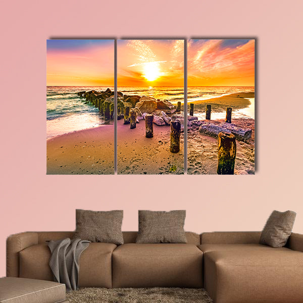 Colorful sunset on a beach multi panel canvas wall art