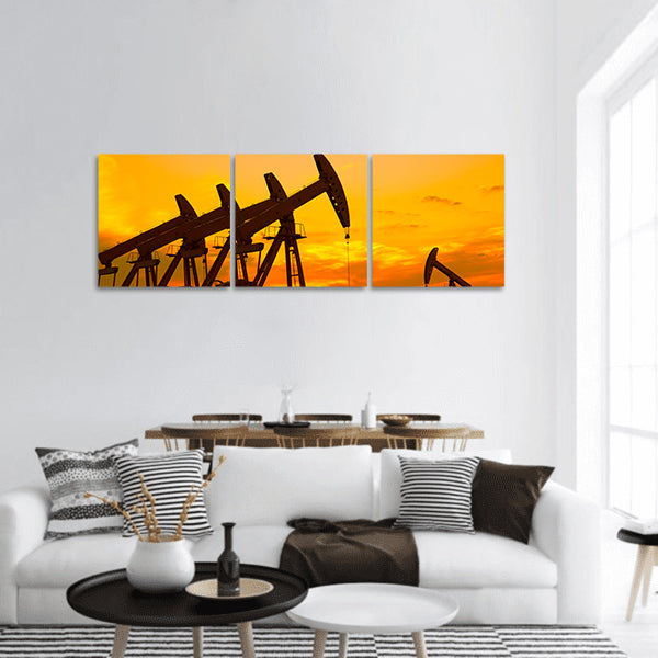 Oil Pump on orange sunset panoramic canvas wall art