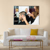 Professional Hairdresser is Making a Haircut with Scissors and a Comb for a Male Customer Multi Panel Canvas Wall Art