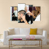 Professional Hairdresser is Making a Haircut with Scissors and a Comb for a Male Customer Multi Panel Canvas Wall Art