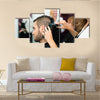 Professional Hairdresser is Making a Haircut with Scissors and a Comb for a Male Customer Multi Panel Canvas Wall Art