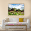 A traditional hut in an Indonesian mountain village Multi panel canvas wall art