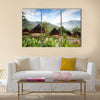 A traditional hut in an Indonesian mountain village Multi panel canvas wall art