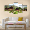 A traditional hut in an Indonesian mountain village Multi panel canvas wall art