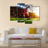 Soccer players in action on sunset stadium background panorama Multi Panel Canvas Art