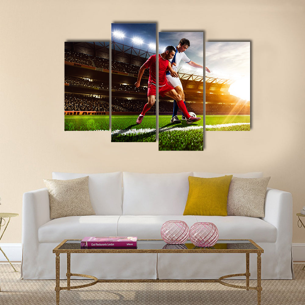 Soccer players in action on sunset stadium background panorama Multi Panel Canvas Art