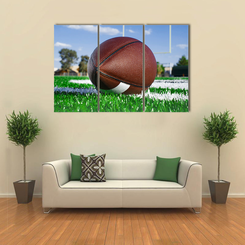 American football on find with goal posts Multi panel canvas wall art