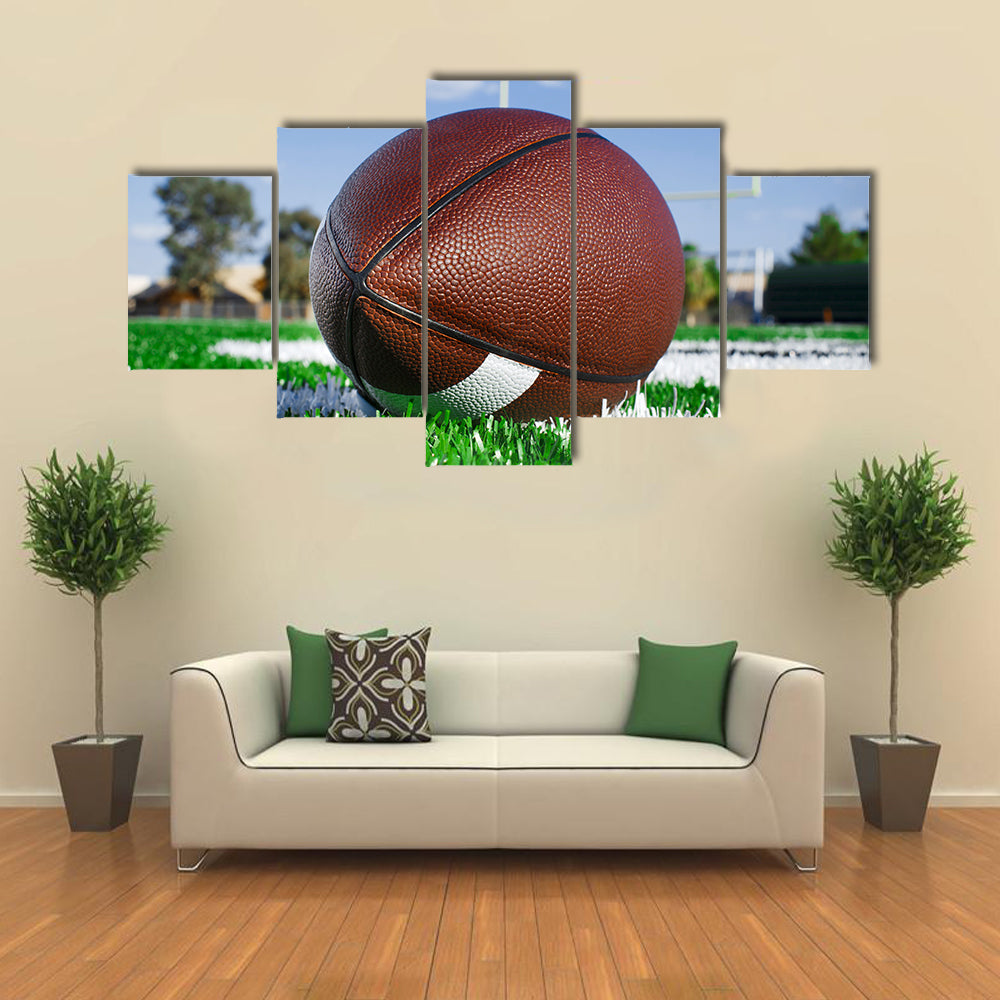 American football on find with goal posts Multi panel canvas wall art