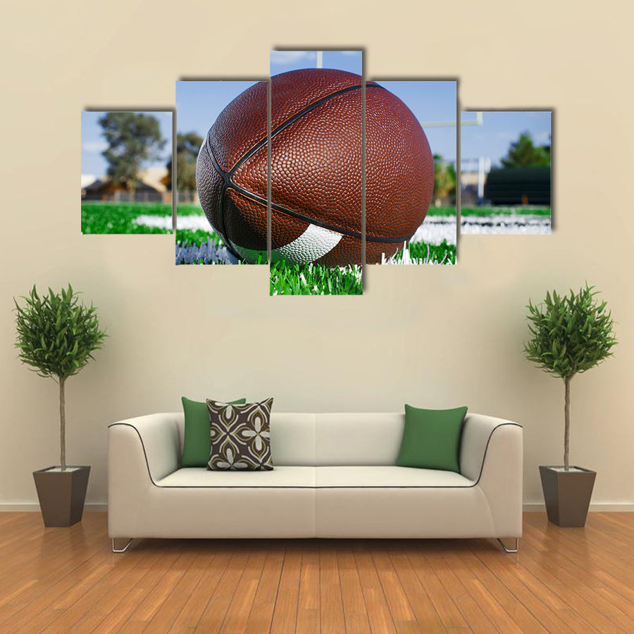 American football on find with goal posts Multi panel canvas wall art