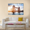 Tower Bridge in London, the UK. Sunset with beautiful clouds. Drawbridge opening. One of English symbols Multi panel canvas wall art