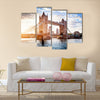 Tower Bridge in London, the UK. Sunset with beautiful clouds. Drawbridge opening. One of English symbols Multi panel canvas wall art