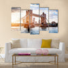 Tower Bridge in London, the UK. Sunset with beautiful clouds. Drawbridge opening. One of English symbols Multi panel canvas wall art