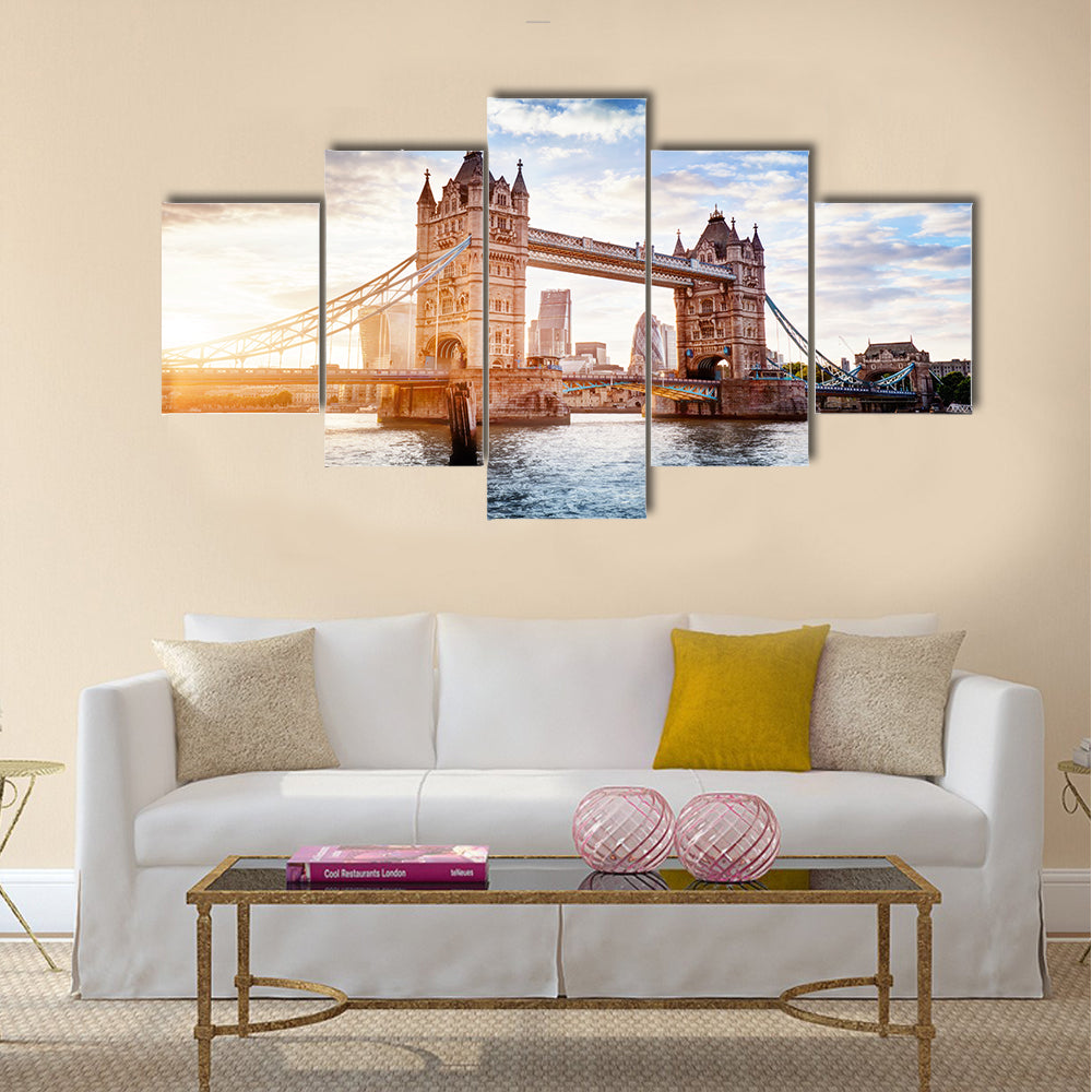 Tower Bridge in London, the UK. Sunset with beautiful clouds. Drawbridge opening. One of English symbols Multi panel canvas wall art
