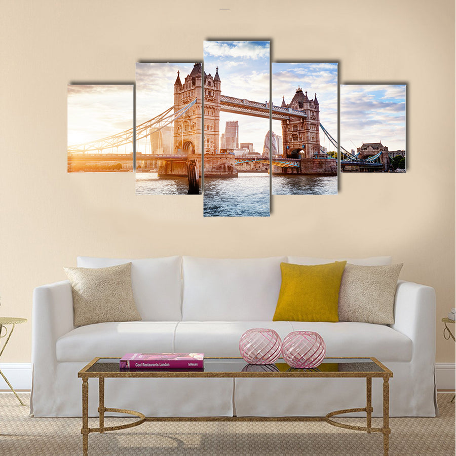 Tower Bridge in London, the UK. Sunset with beautiful clouds. Drawbridge opening. One of English symbols Multi panel canvas wall art