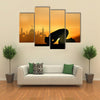 A Muslim Bowing Down In Front Of God Praying At Sunset Multi Panel Canvas Wall Art