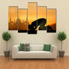 A Muslim Bowing Down In Front Of God Praying At Sunset Multi Panel Canvas Wall Art