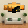 A Muslim Bowing Down In Front Of God Praying At Sunset Multi Panel Canvas Wall Art