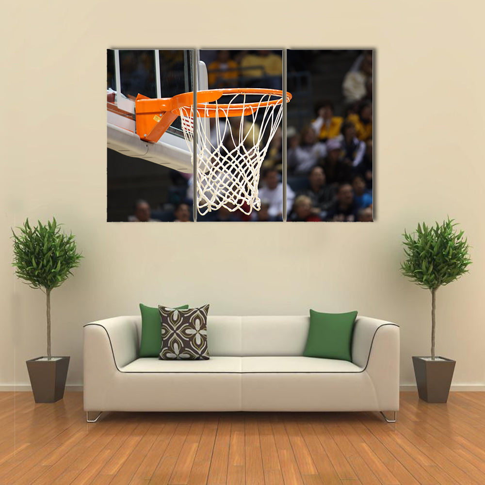 Basketball rim in focus with a glass backboard Multi panel canvas wall art