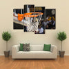 Basketball rim in focus with a glass backboard Multi panel canvas wall art