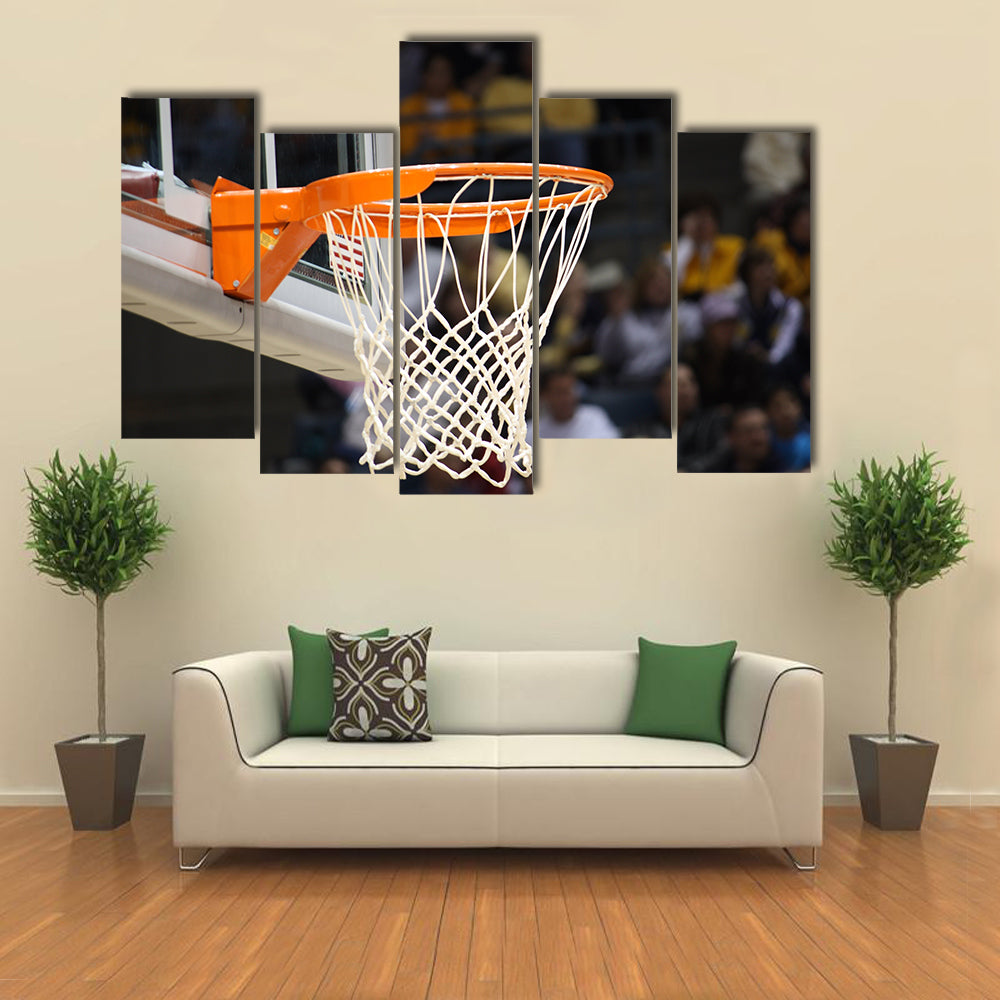 Basketball rim in focus with a glass backboard Multi panel canvas wall art