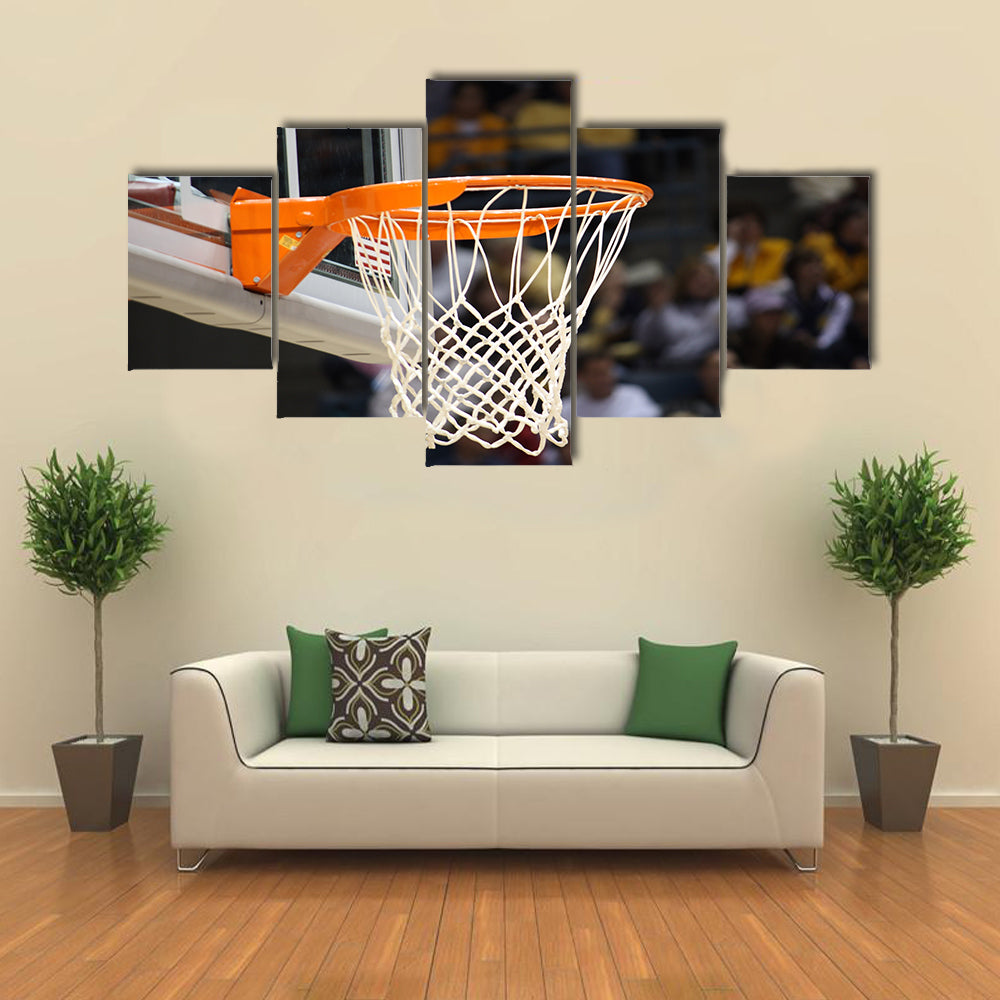 Basketball rim in focus with a glass backboard Multi panel canvas wall art