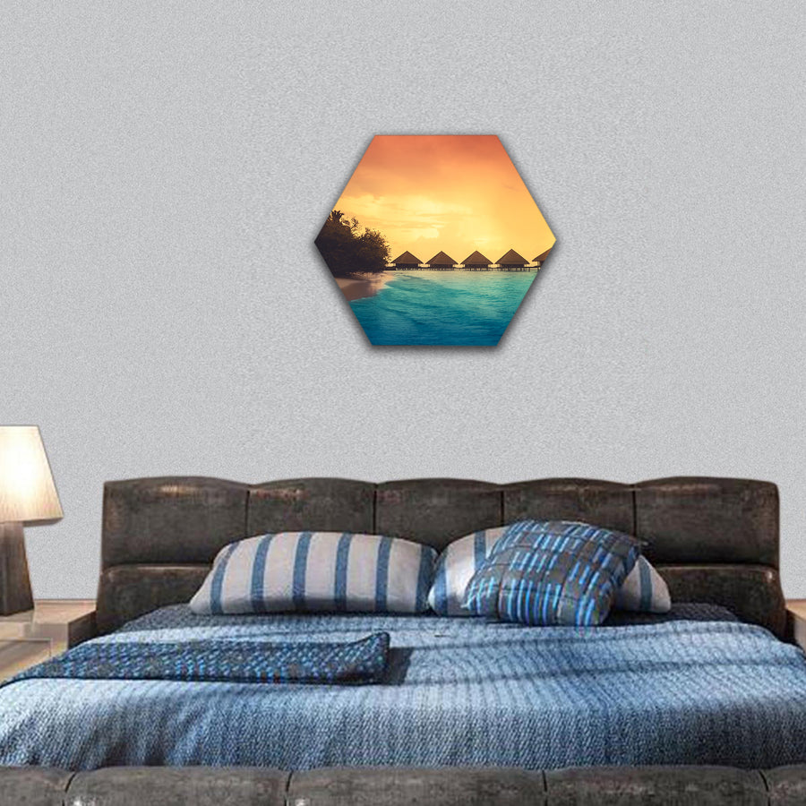 Over water bungalows with steps into amazing green lagoon hexagonal canvas wall art