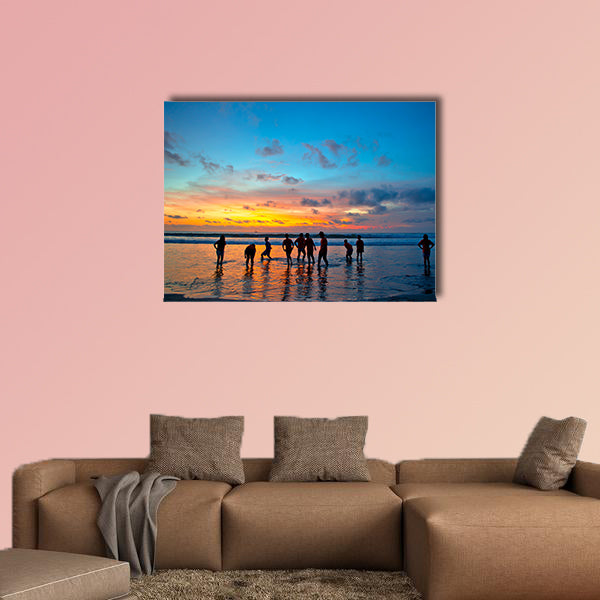 Silhouettes of young people at famous sunset beach wall art