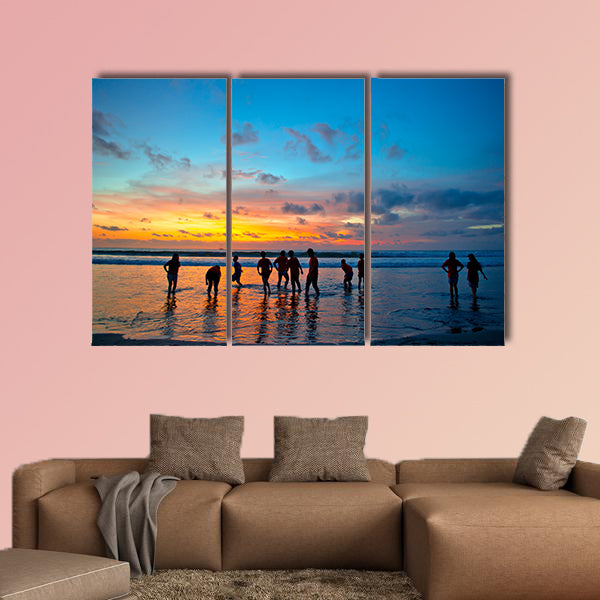 Silhouettes of young people at famous sunset beach wall art
