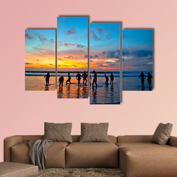 Silhouettes of young people at famous sunset beach wall art