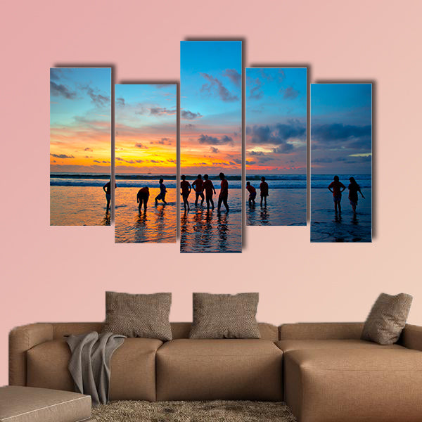 Silhouettes of young people at famous sunset beach wall art