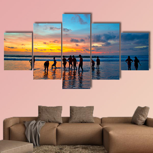 Silhouettes of young people at famous sunset beach wall art