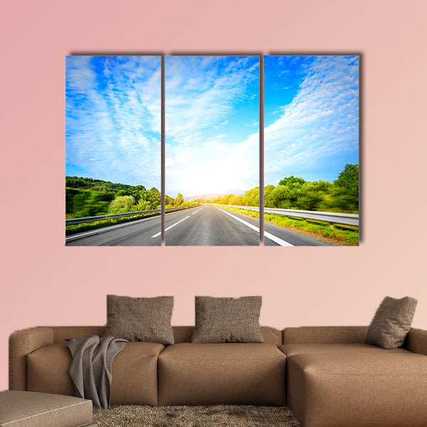 Highway outside the city at sunset multi panel canvas wall art