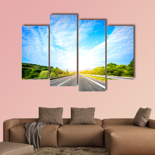 Highway outside the city at sunset multi panel canvas wall art