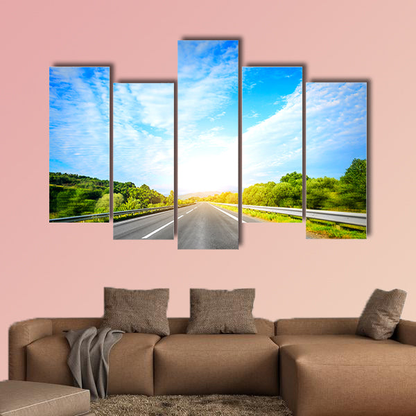 Highway outside the city at sunset multi panel canvas wall art
